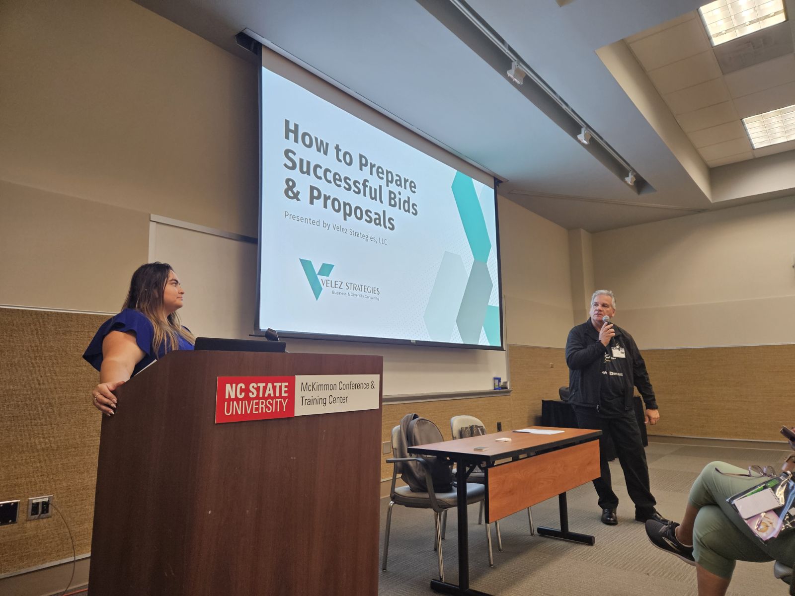 Velez Strategies presenting a workshop on preparing successful bids and proposals